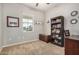 Home office with built-in bookshelf and ample desk space at 22608 W Gardenia Dr, Buckeye, AZ 85326