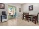Kitchen dining area with sliding door to backyard access at 22608 W Gardenia Dr, Buckeye, AZ 85326