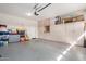 Garage with built-in storage cabinets and overhead door at 22608 W Gardenia Dr, Buckeye, AZ 85326