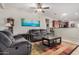 Cozy living room with comfortable seating and a view into the kitchen at 22608 W Gardenia Dr, Buckeye, AZ 85326