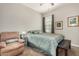 Comfortable bedroom with recliner and ensuite access at 22608 W Gardenia Dr, Buckeye, AZ 85326
