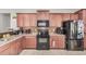 Well-equipped kitchen featuring ample cabinetry and granite counters at 22608 W Gardenia Dr, Buckeye, AZ 85326