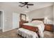 Spacious bedroom with ceiling fan and ample closet space at 22608 W Gardenia Dr, Buckeye, AZ 85326