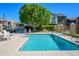 Inviting community pool with lounge chairs and a shaded seating area at 17365 N Cave Creek Rd # 246, Phoenix, AZ 85032