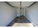 Attached garage with painted concrete floor and overhead storage at 17365 N Cave Creek Rd # 246, Phoenix, AZ 85032