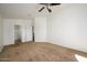Spacious bedroom with ceiling fan and en-suite bathroom access at 17365 N Cave Creek Rd # 246, Phoenix, AZ 85032