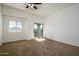 Spacious bedroom with neutral carpet and private balcony access at 17365 N Cave Creek Rd # 246, Phoenix, AZ 85032
