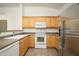 Well-equipped kitchen with light wood cabinets and stainless steel appliances at 17365 N Cave Creek Rd # 246, Phoenix, AZ 85032