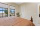 Spacious bedroom with king-size bed and tranquil views at 10803 W Dove Roost Rd, Queen Creek, AZ 85144