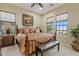 Bright bedroom with a king-size bed and large windows at 10803 W Dove Roost Rd, Queen Creek, AZ 85144