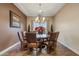 Formal dining room, featuring a wood table and leather chairs at 10803 W Dove Roost Rd, Queen Creek, AZ 85144