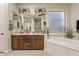Elegant bathroom with soaking tub, double vanity, and walk-in shower at 10803 W Dove Roost Rd, Queen Creek, AZ 85144