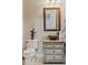Powder room with rustic vanity and copper sink at 10803 W Dove Roost Rd, Queen Creek, AZ 85144
