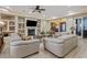 Spacious living area showcasing a cozy fireplace and ample seating at 10803 W Dove Roost Rd, Queen Creek, AZ 85144
