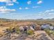 Aerial view of a single-story house with desert landscape at 10803 W Dove Roost Rd, Queen Creek, AZ 85144