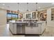 Gourmet kitchen with large island and stainless steel appliances at 10803 W Dove Roost Rd, Queen Creek, AZ 85144