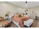 Main bedroom with a sitting area and large window at 10803 W Dove Roost Rd, Queen Creek, AZ 85144