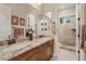 Bathroom boasts double sinks, granite counters, and a walk-in shower at 10803 W Dove Roost Rd, Queen Creek, AZ 85144