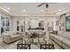 Bright and airy living room with multiple seating areas at 10803 W Dove Roost Rd, Queen Creek, AZ 85144