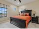 Spacious bedroom with large window and dark wood furniture at 10803 W Dove Roost Rd, Queen Creek, AZ 85144