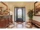 Elegant entryway with decorative door and wood console table at 10803 W Dove Roost Rd, Queen Creek, AZ 85144
