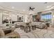 Open concept living room with large windows and comfortable seating at 10803 W Dove Roost Rd, Queen Creek, AZ 85144