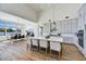 Modern kitchen with large island and breakfast bar, hardwood flooring at 3329 W Desert Dawn Dr, Phoenix, AZ 85083