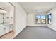 Bright bedroom with carpet flooring and en-suite bathroom access at 3329 W Desert Dawn Dr, Phoenix, AZ 85083
