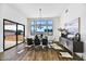 Bright dining room with hardwood floors, modern chandelier, and large windows at 3329 W Desert Dawn Dr, Phoenix, AZ 85083