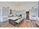 Spacious kitchen with white cabinets, large island, and hardwood floors at 3329 W Desert Dawn Dr, Phoenix, AZ 85083