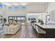 Open living area with hardwood floors, modern furniture, and sliding glass doors leading to backyard at 3329 W Desert Dawn Dr, Phoenix, AZ 85083