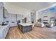 Modern kitchen with large island, white cabinets, and high-end appliances at 3329 W Desert Dawn Dr, Phoenix, AZ 85083