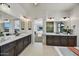 Modern bathroom with double vanity, large mirrors, and a view to the bedroom at 3329 W Desert Dawn Dr, Phoenix, AZ 85083