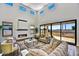Open living space with fireplace, high ceilings, and sliding doors to patio at 3329 W Desert Dawn Dr, Phoenix, AZ 85083