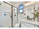 Clean bathroom with a large walk-in shower and white tile at 3329 W Desert Dawn Dr, Phoenix, AZ 85083