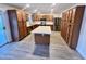 Updated kitchen with stainless steel appliances and a large island at 1737 N Trevor Dr, Mesa, AZ 85201