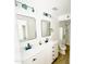 Updated bathroom with double vanity, large mirrors and shower at 1737 N Trevor Dr, Mesa, AZ 85201