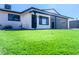 Updated mid-century home with artificial turf lawn and modern facade at 1737 N Trevor Dr, Mesa, AZ 85201