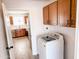 Laundry room with washer, dryer, and cabinets at 1737 N Trevor Dr, Mesa, AZ 85201