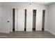 Bedroom with double closets and wood-look floors at 1737 N Trevor Dr, Mesa, AZ 85201