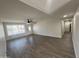 Open living room with wood-look tile floor and neutral color palette at 1737 N Trevor Dr, Mesa, AZ 85201