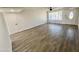 Bright living room featuring wood-look tile floors and neutral walls at 1737 N Trevor Dr, Mesa, AZ 85201