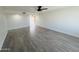 Open concept living area with neutral walls and wood-look tile floors at 1737 N Trevor Dr, Mesa, AZ 85201