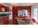 Kitchen with dark wood cabinets, granite counters, and breakfast bar at 14062 N 48Th Ave, Glendale, AZ 85306