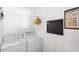 Bright laundry room with washer, dryer, and storage at 1413 E Windsor Ave, Phoenix, AZ 85006