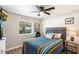 Guest bedroom with a full-size bed and wood accent wall at 1413 E Windsor Ave, Phoenix, AZ 85006