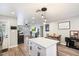 Modern kitchen island with white cabinets and quartz countertops at 1413 E Windsor Ave, Phoenix, AZ 85006