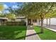 Charming ranch home with brick walkway and lush lawn at 1413 E Windsor Ave, Phoenix, AZ 85006