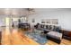 Living room with hardwood floors, L-shaped sofa, and open layout at 4701 N 68Th St # 144, Scottsdale, AZ 85251