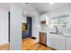 Modern white kitchen with stainless steel appliances and wood flooring at 4701 N 68Th St # 144, Scottsdale, AZ 85251